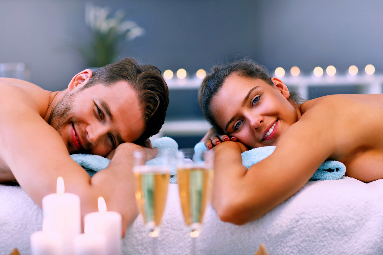 Lovely Couple Smiling During In-Home Couples Massage